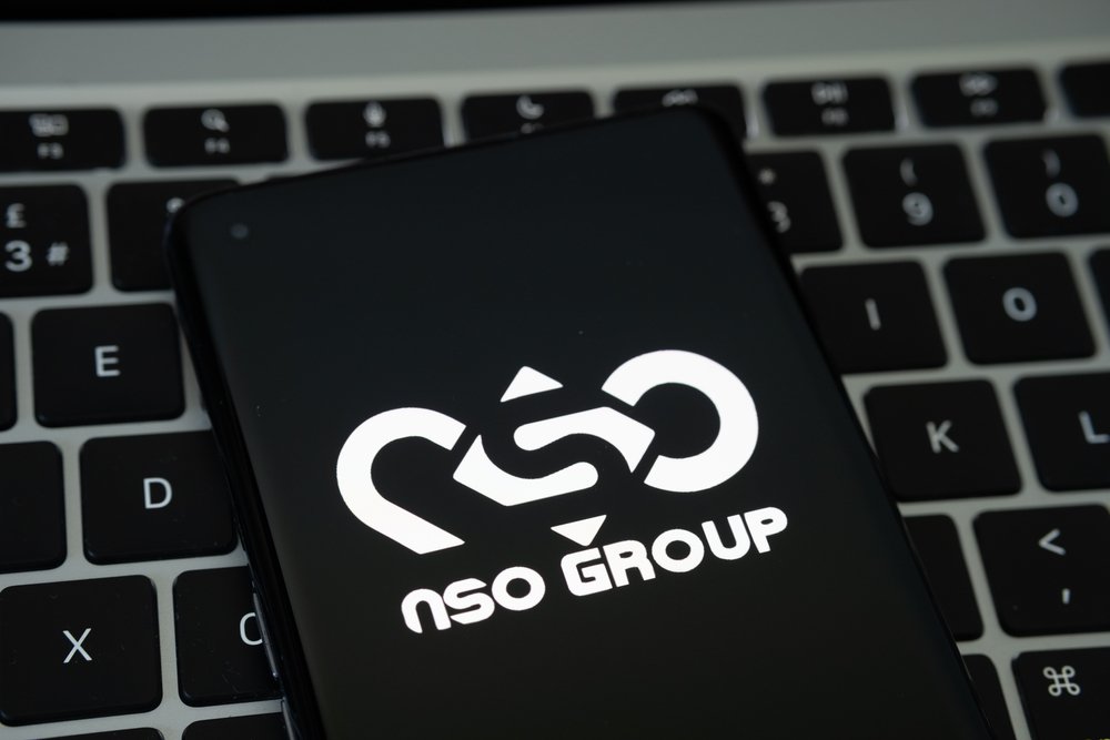 nso, group, logo, seen, on, the, smartphone, placed, on, laptop